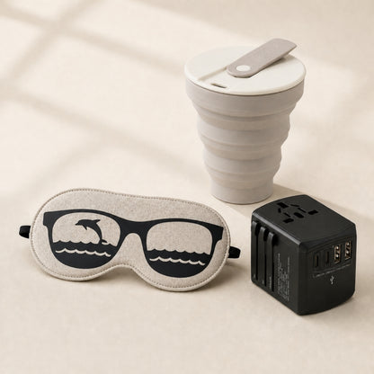 trekaro Entspannt-Reisen-Paket: Nachtmaske Delfin, faltbarer Kaffeebecher und Universal-Reiseadapter